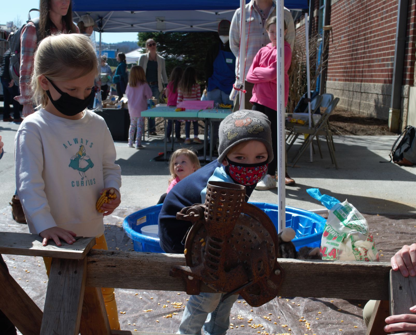 husking corn at buildfest.jpg